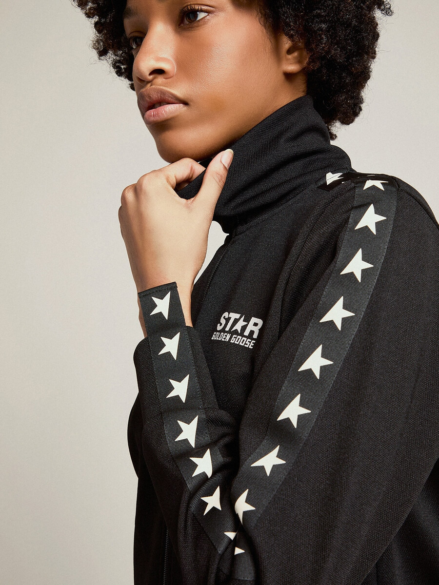 schwarzes damen-sweatshirt mit reißverschluss und weißen sternen
