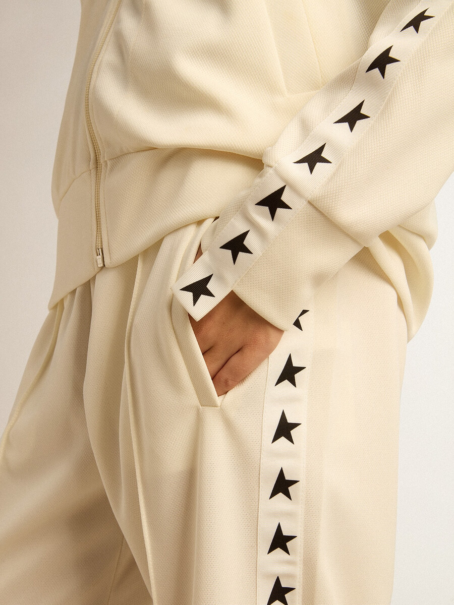 weißes damen-sweatshirt mit reißverschluss weißem streifen und schwarzen sternen