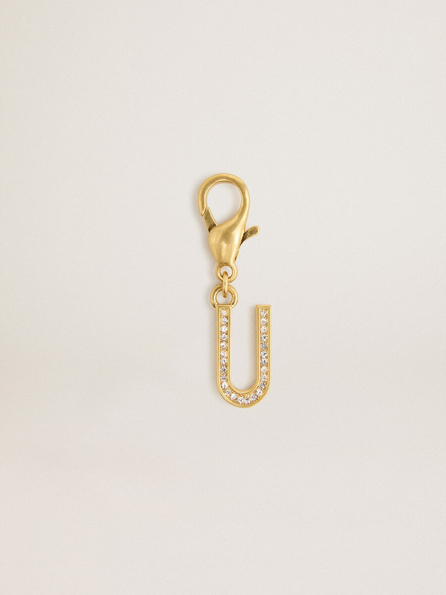 anhänger mit dem buchstaben u aus goldfarbenem messing und kristallen