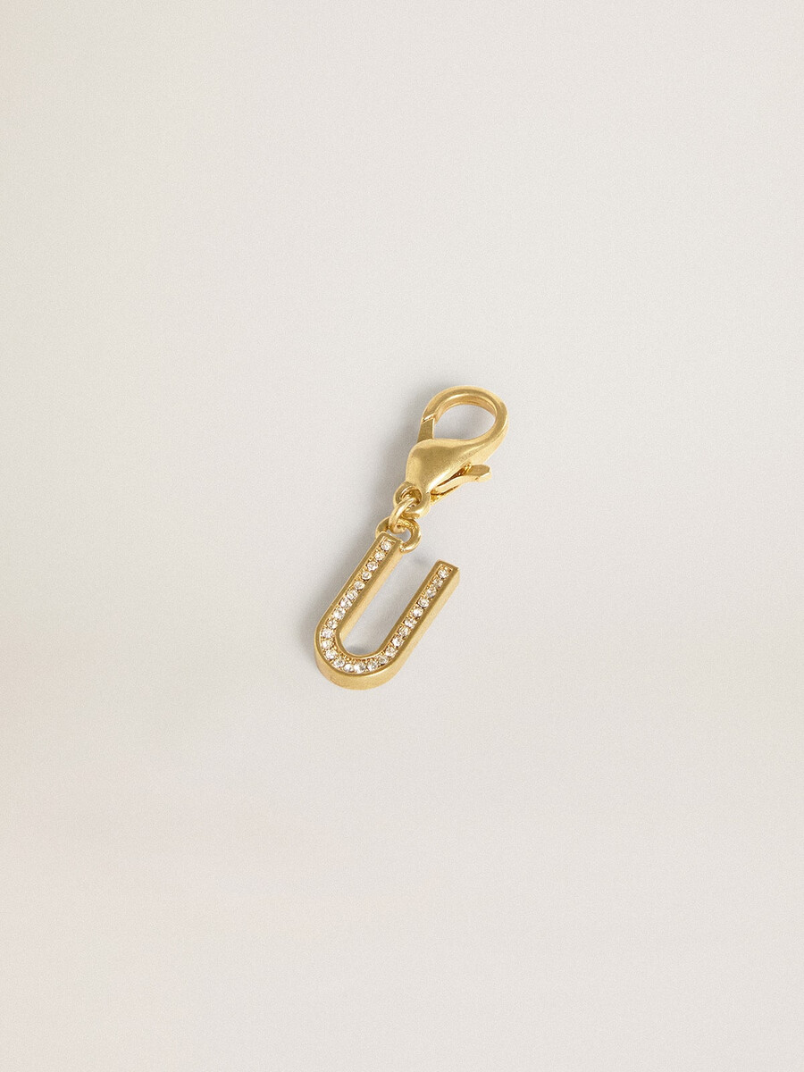 anhänger mit dem buchstaben u aus goldfarbenem messing und kristallen