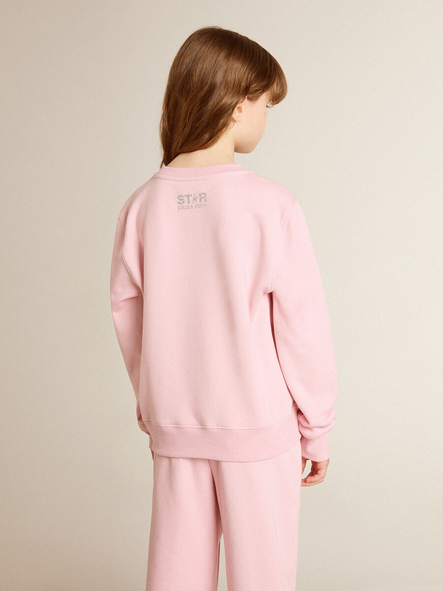 rosa sweatshirt mit großem silbernen glitzerstern auf der vorderseite