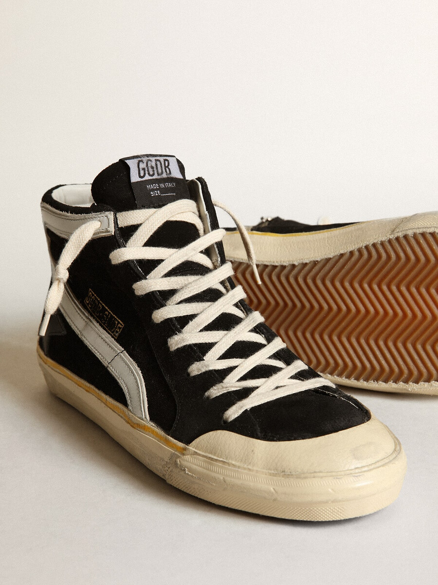 herren-slipper penstar aus schwarzem wildleder mit schwarzem stern und weißem glitzer.