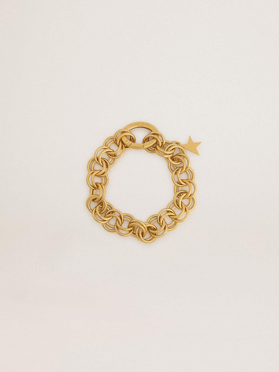 antikes goldfarbenes armband aus gewebter kette mit sternförmigem verschluss
