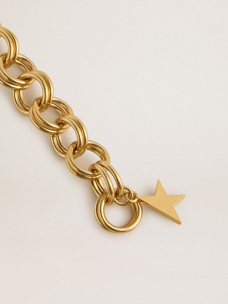 antikes goldfarbenes armband aus gewebter kette mit sternförmigem verschluss