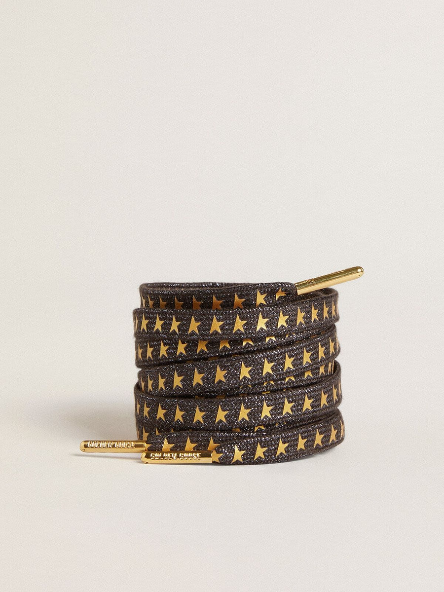 dunkelgraue lurex-schnürsenkel mit kontrastierenden goldenen sternen