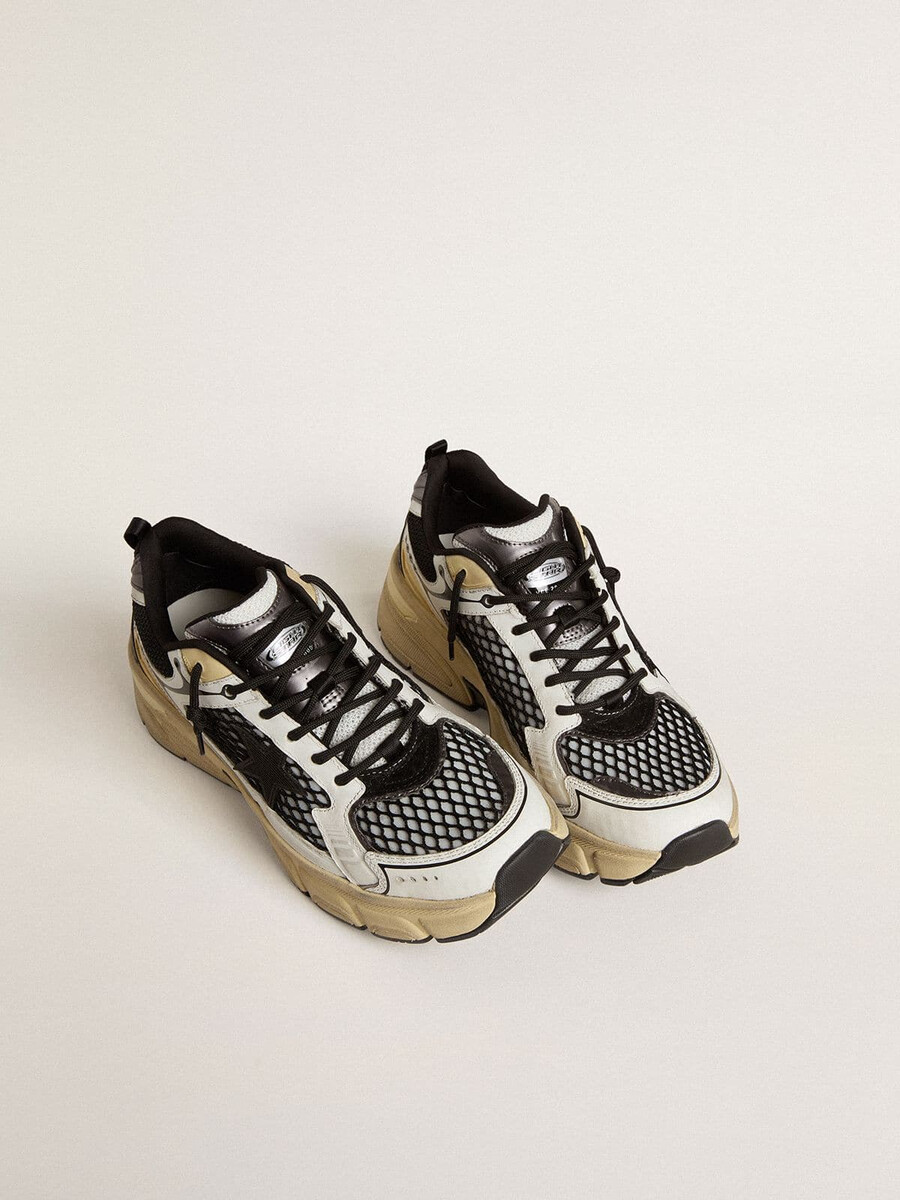 lightstar damenschuh aus weißem leder und schwarzem mesh mit schwarzem tpu-stern