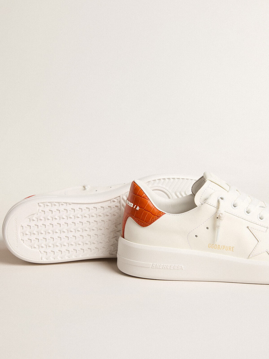 purestar damenschuh mit weißem lederstern und orangefarbener fersenlasche