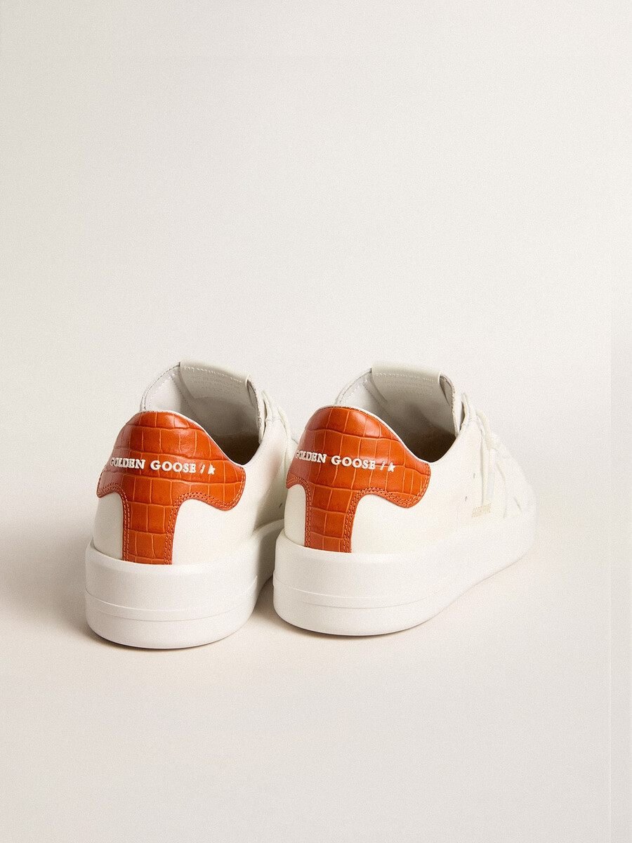 purestar damenschuh mit weißem lederstern und orangefarbener fersenlasche