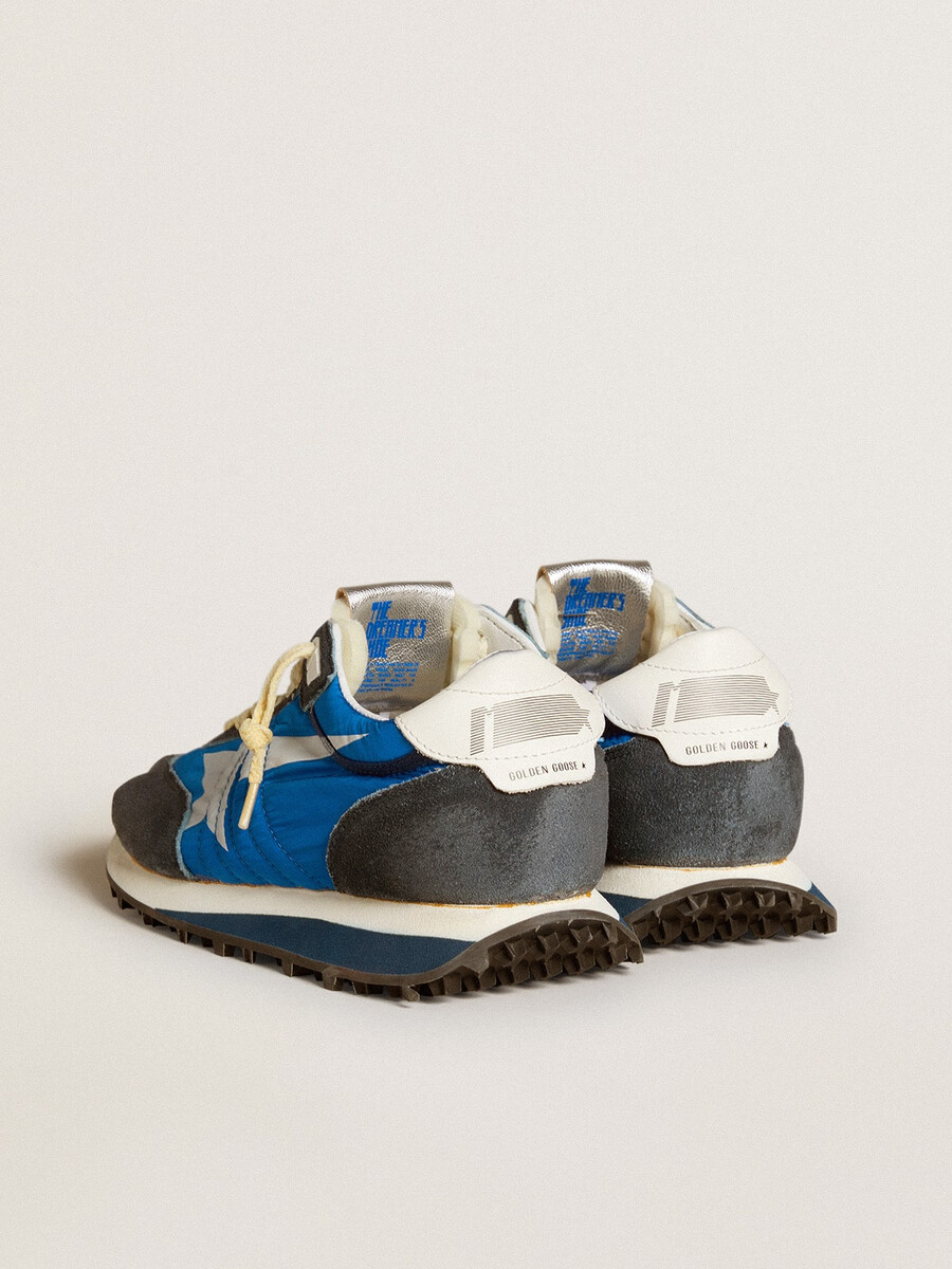damen-marathonschuh mit blauem nylon-obermaterial und weißem stern