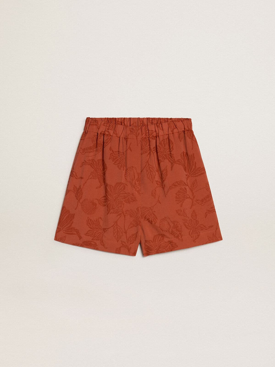 damenshorts aus ziegelrotem jacquard mit maritimem blumenmuster