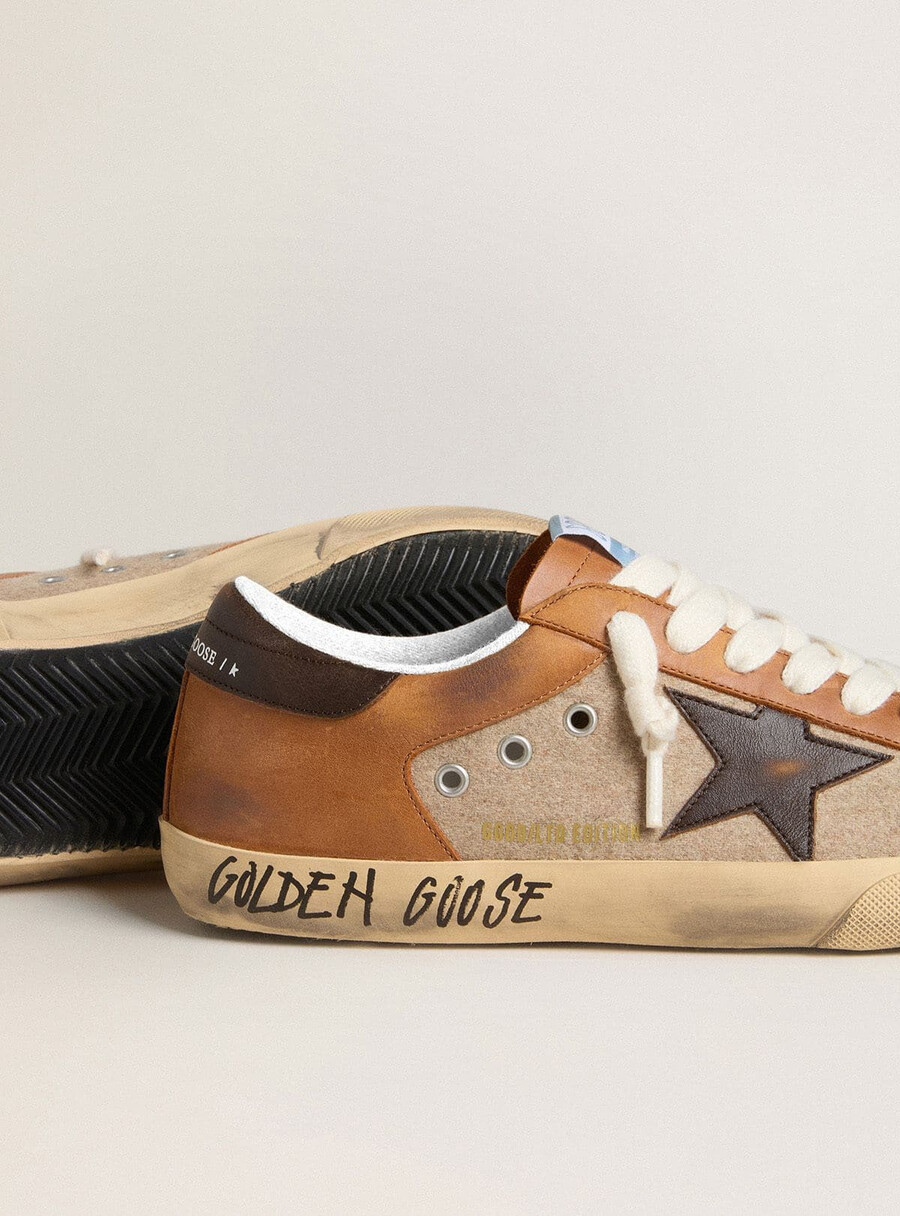 herren super-star ltd aus beiger wolle mit braunem lederstern und kamelfarbenen einsätzen
