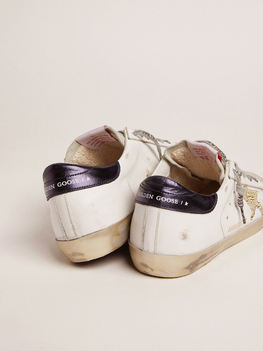 damen-superstar mit blauer fersenlasche und swarovski-kristallstern