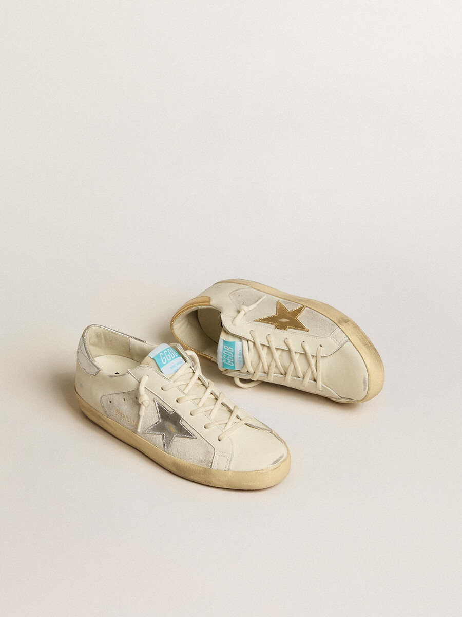 super-star aus weißem leder und wildleder mit silbernem und goldenem lederstern