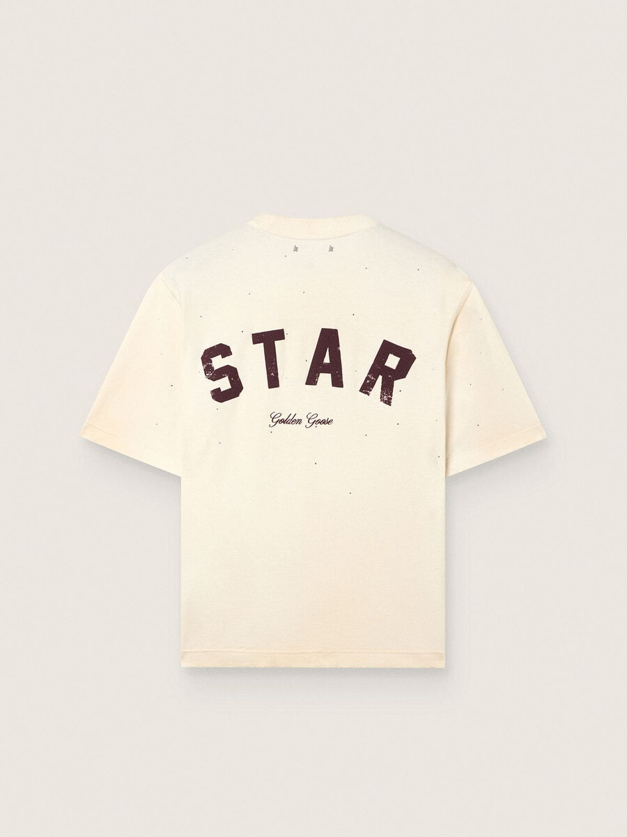 unisex-t-shirt mit sternenmuster aus weißer baumwolle mit durchgehendem farbverlauf und kristallen sowie einem aufdruck auf der rückseite.