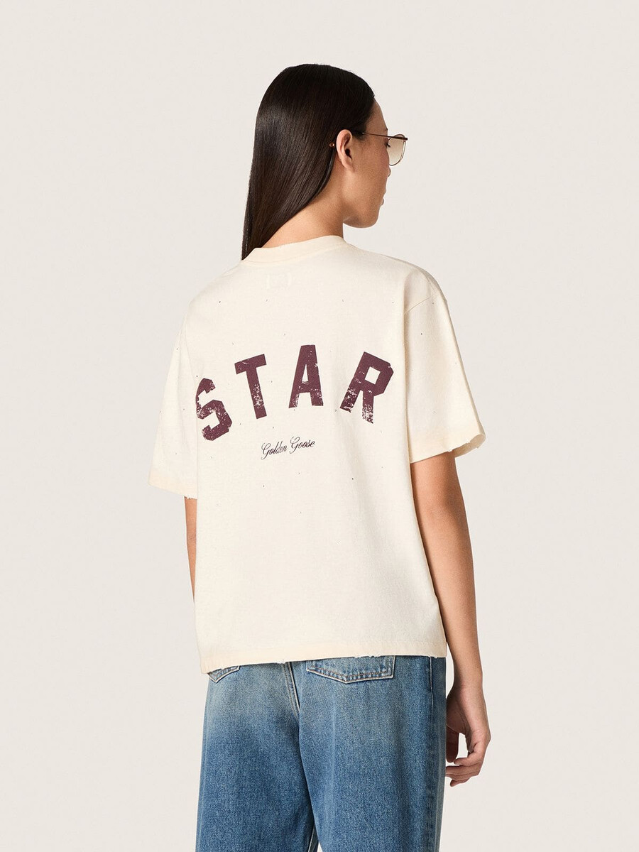 unisex-t-shirt mit sternenmuster aus weißer baumwolle mit durchgehendem farbverlauf und kristallen sowie einem aufdruck auf der rückseite.