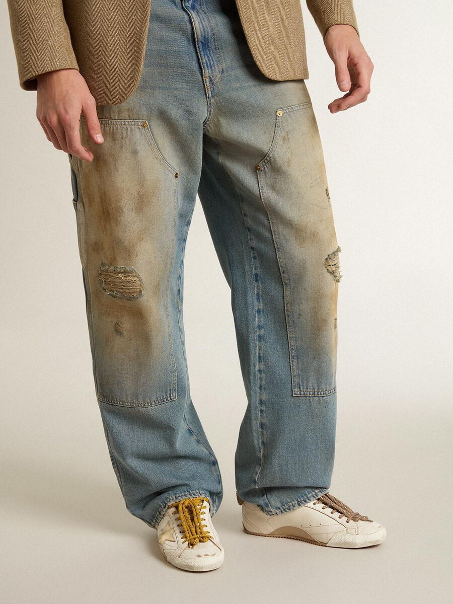 herren-sneaker true-star aus weißem nappaleder mit goldfoliengeprägtem lederstern und beigefarbener wildleder-fersenlasche.