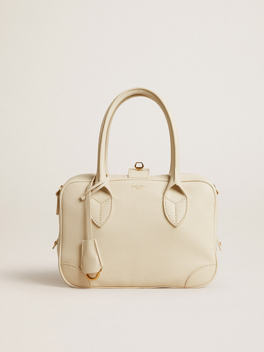 vita-tasche aus butterfarbenem leder mit goldenen details